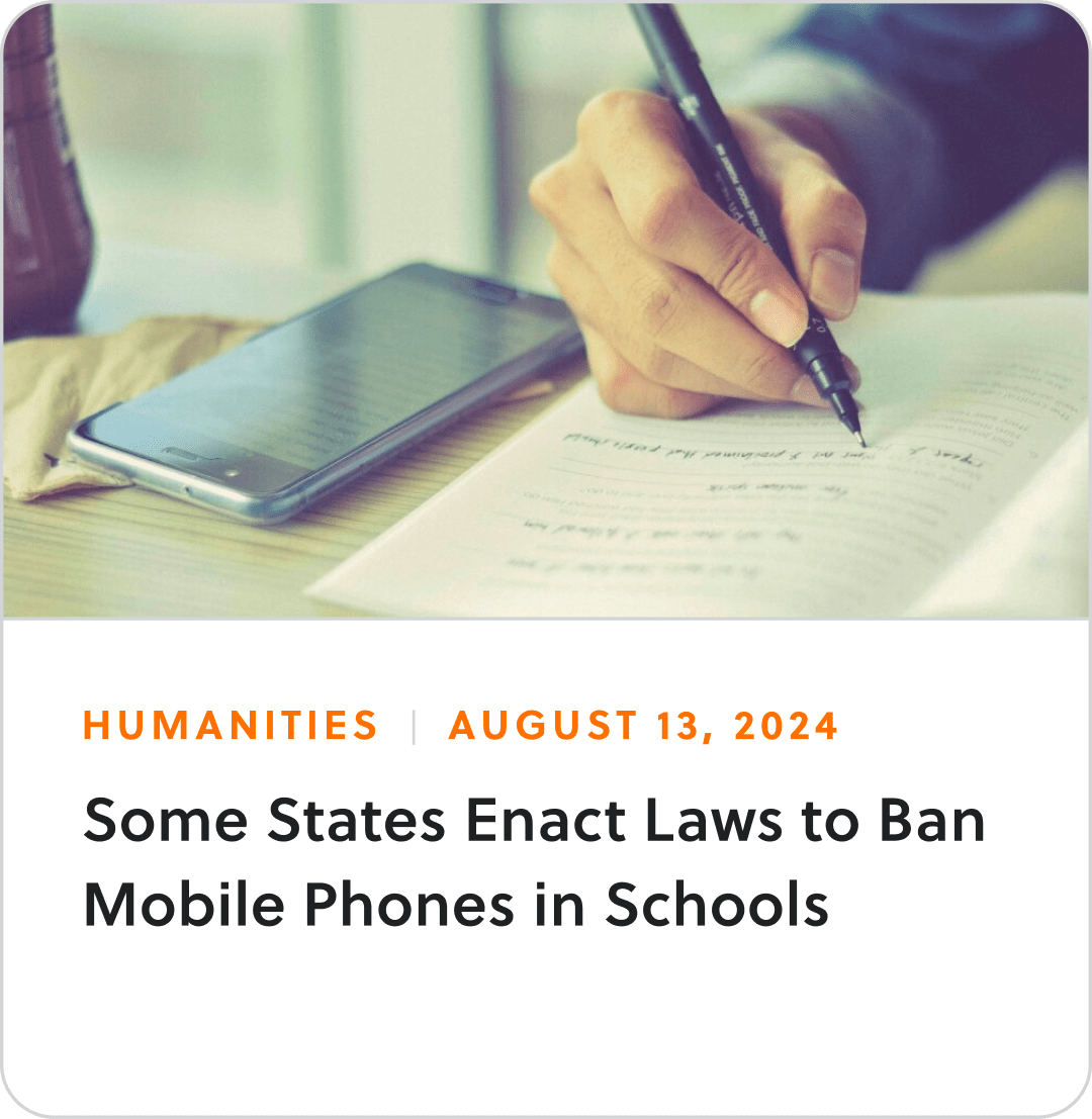 Humanities article with a hand filling out math problems on a notebook and the title "Some states enact laws to ban mobile phones in schools"