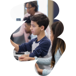 a student using a computer in a computer lab at school